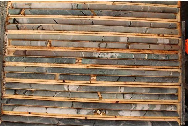 80.00 - 99.50 metres: Quartz-Ankerite-Carbonate veins injected in felsic dyke. At 99.00 metres, 1.0 metre wide quartz-ankerite vein with coarse pyrite.